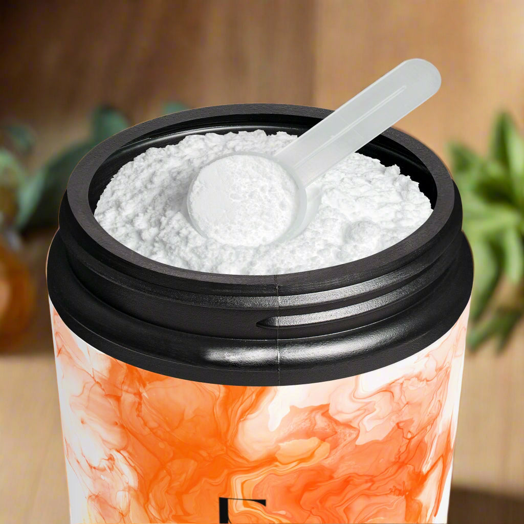 Container with white powder and a scoop, featuring an orange and white marbled design.