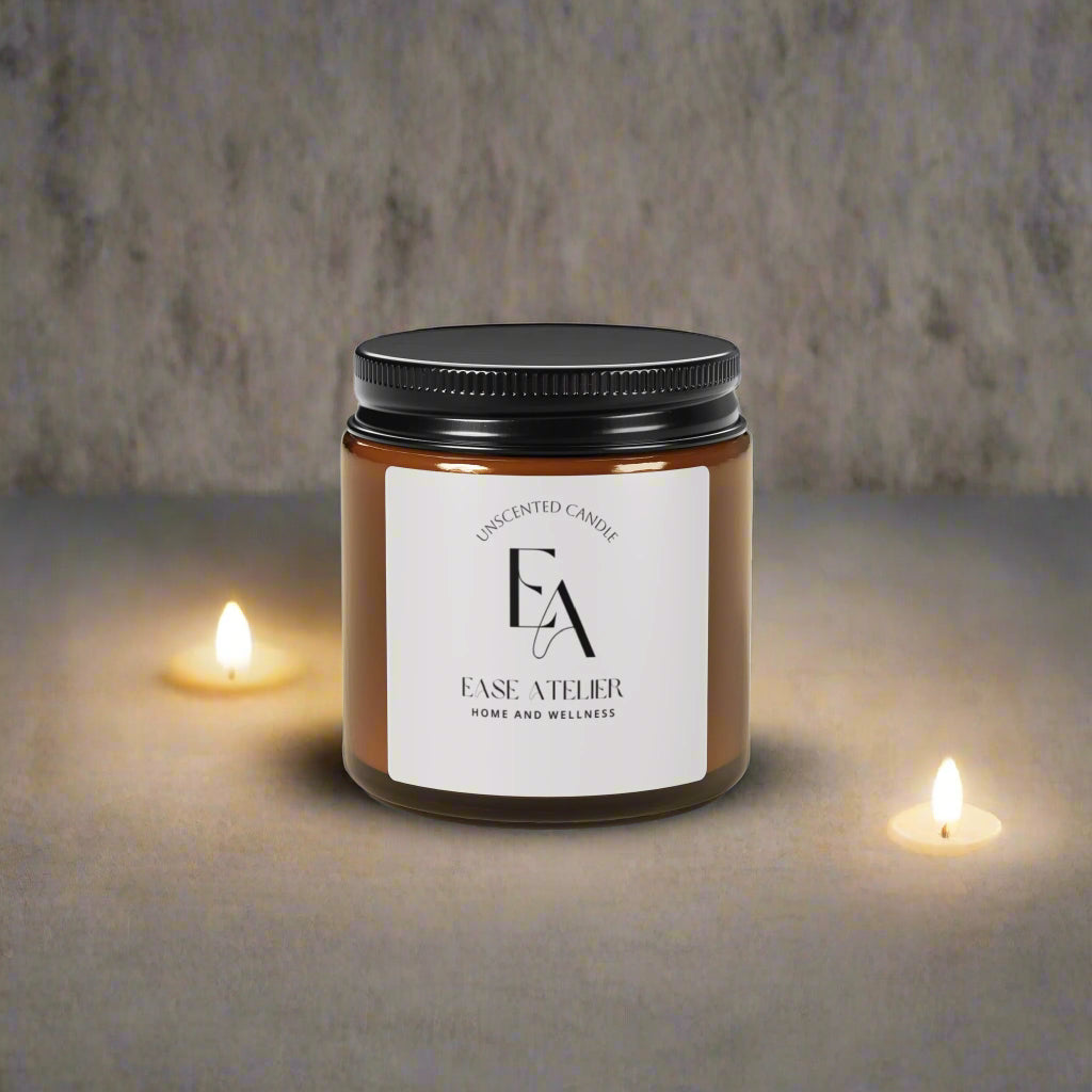 Candle jar with black lid and white label on a white background