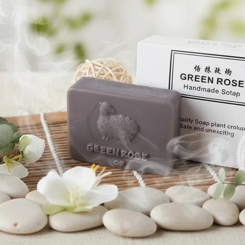Bar of soap with 'Green Rose' branding on a wooden background