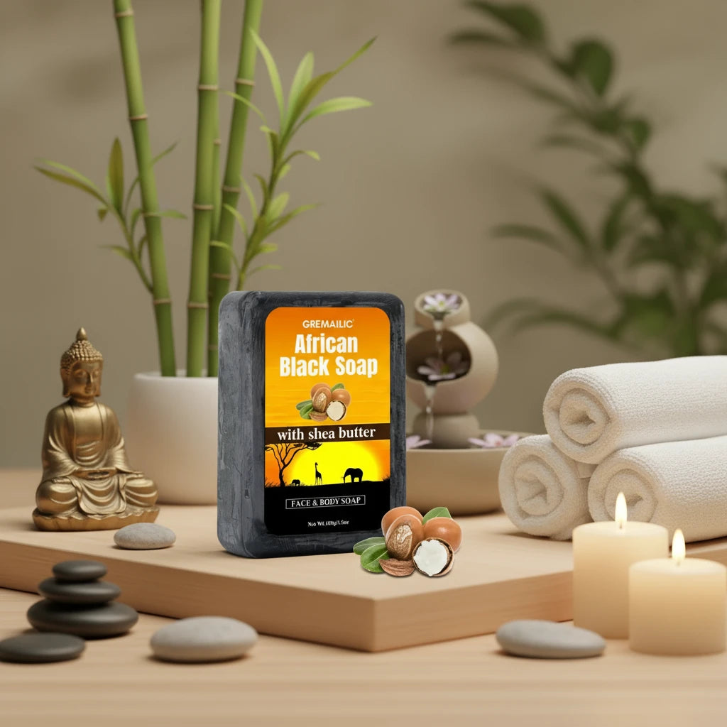 African Black Soap with Shea Butter packaging on a decorative surface with plants and jars.